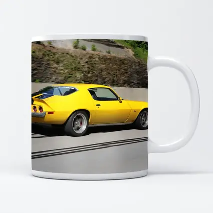 Yellow Chevrolet Camaro Z28 on Highway