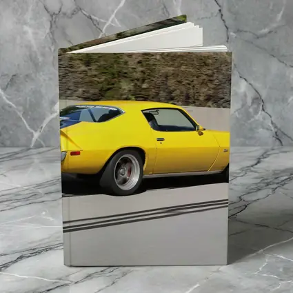 Yellow Chevrolet Camaro Z28 on Highway