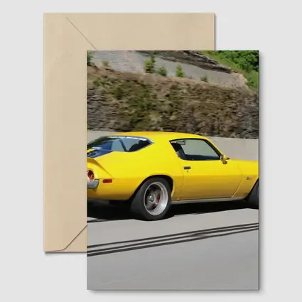 Yellow Chevrolet Camaro Z28 on Highway