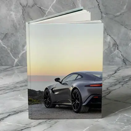 Aston Martin Vantage Silver Coastal Sunset View