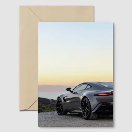 Aston Martin Vantage Silver Coastal Sunset View