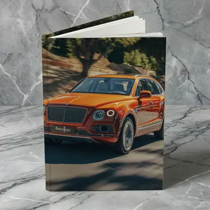 Bentley Bentayga Hybrid Orange On Road