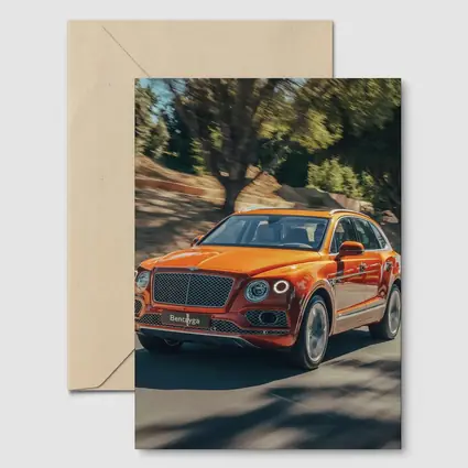 Bentley Bentayga Hybrid Orange On Road