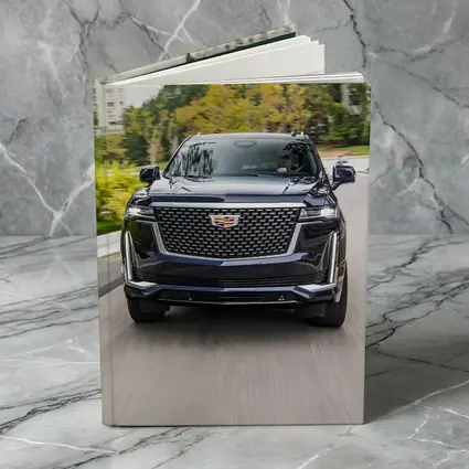 Cadillac Escalade Driving City Street Front View