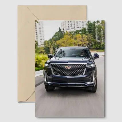 Cadillac Escalade Driving City Street Front View