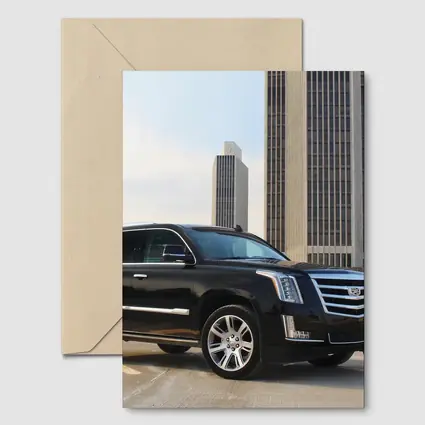 Cadillac Escalade Black SUV City Buildings