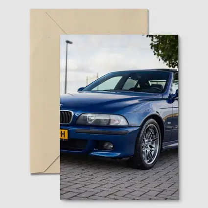 BMW E39 M5 Blue Sedan Parked Outside