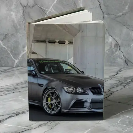 BMW M3 Sedan Matte Gray Under Concrete Bridge