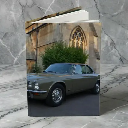 Classic Jaguar XJC Olive Green Church Background