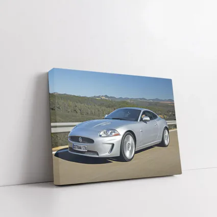 Jaguar XK Silver Coupe On Open Road