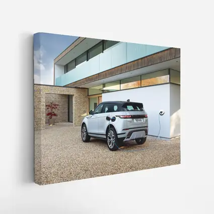 Range Rover Evoque Charging At Modern House