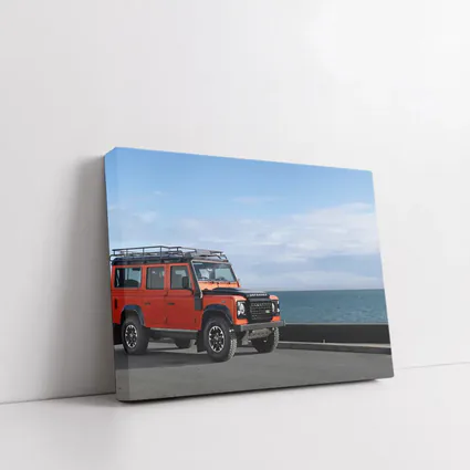 Land Rover Defender Orange Coastal Road Scene