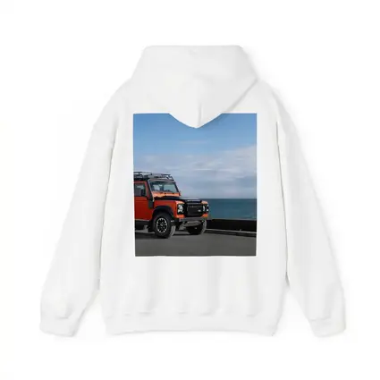 Land Rover Defender Orange Coastal Road Scene