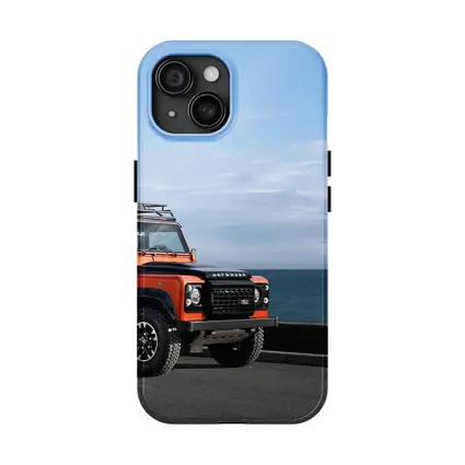 Land Rover Defender Orange Coastal Road Scene