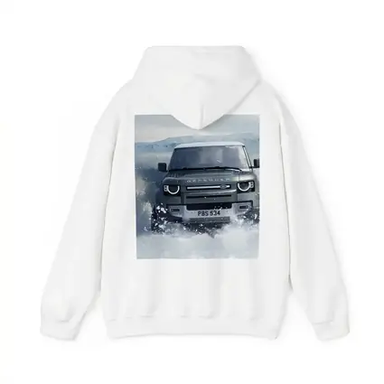 Land Rover Defender Charging Through Snow Landscape