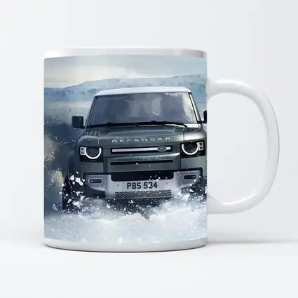 Land Rover Defender Charging Through Snow Landscape