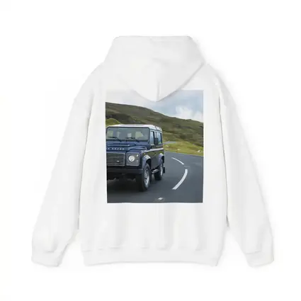 Land Rover Defender Rolling Through Highland Roads