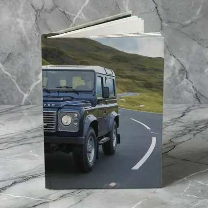 Land Rover Defender Rolling Through Highland Roads