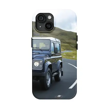 Land Rover Defender Rolling Through Highland Roads