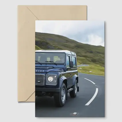 Land Rover Defender Rolling Through Highland Roads