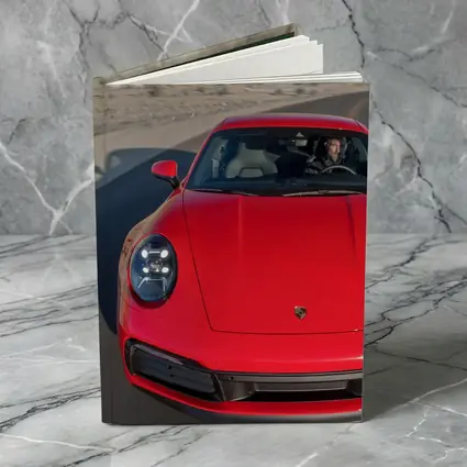 Red Porsche 911 on Mountain Road