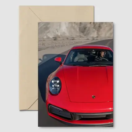Red Porsche 911 on Mountain Road