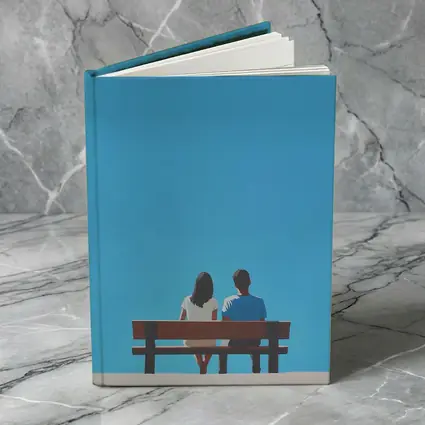 Couple Sitting On Bench Blue Sky