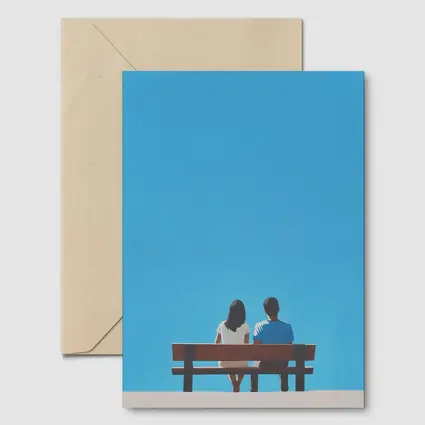Couple Sitting On Bench Blue Sky