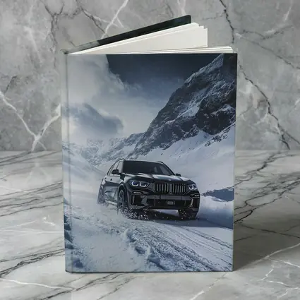 BMW X5 Driving Through Snowy Mountain Pass