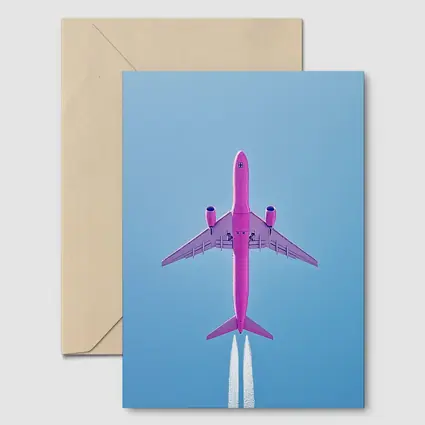 Pink Airplane Flying Against Blue Sky