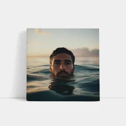 Man Emerging From Ocean At Sunset
