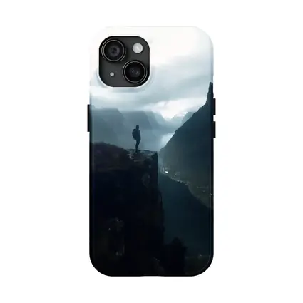 Hiker Standing On Cliff Above Misty Fjord