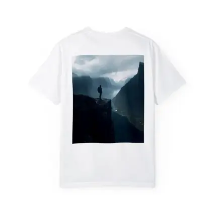 Hiker Standing On Cliff Above Misty Fjord