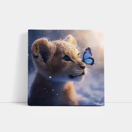 Lion Cub With Blue Butterfly In Snow