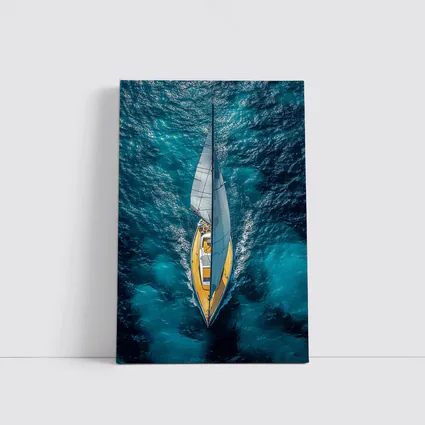 Aerial Sailboat Gliding Over Deep Blue Ocean
