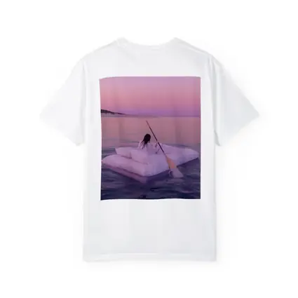 Woman Floating on Raft at Pink Sunset