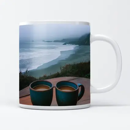 Two Coffee Mugs Foggy Coastal Beach View