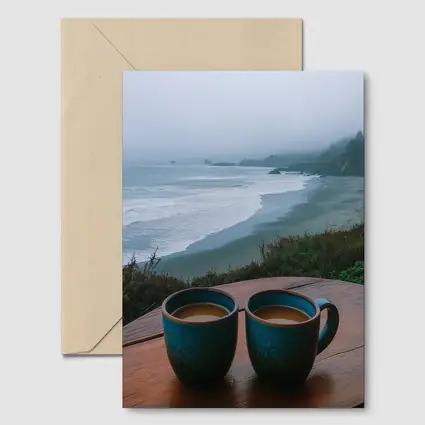 Two Coffee Mugs Foggy Coastal Beach View