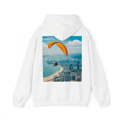 Paraglider Soaring Over Coastal City Skyline