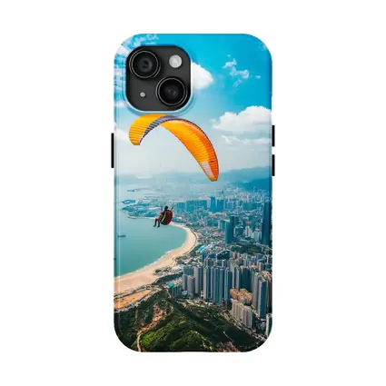 Paraglider Soaring Over Coastal City Skyline