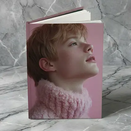 Young Boy Looking Up Pink Background