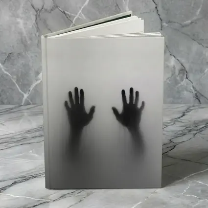 Two Shadowy Hands Pressing Through Fog