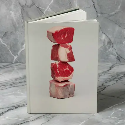 Stacked Raw Beef Cuts Gray Background