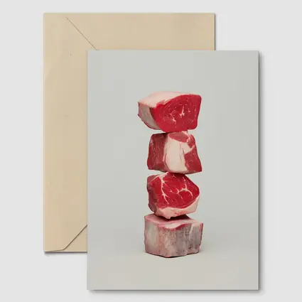 Stacked Raw Beef Cuts Gray Background