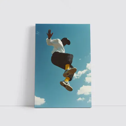 Man Jumping High Against Blue Sky