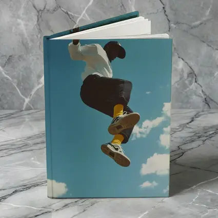 Man Jumping High Against Blue Sky