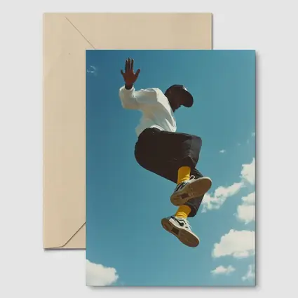 Man Jumping High Against Blue Sky