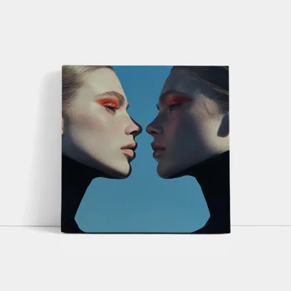 Two Women Facing Orange Eye Makeup Blue