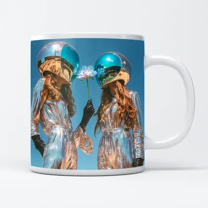 Two Women Astronaut Helmets Silver Suits Sky