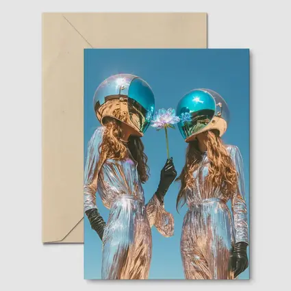 Two Women Astronaut Helmets Silver Suits Sky